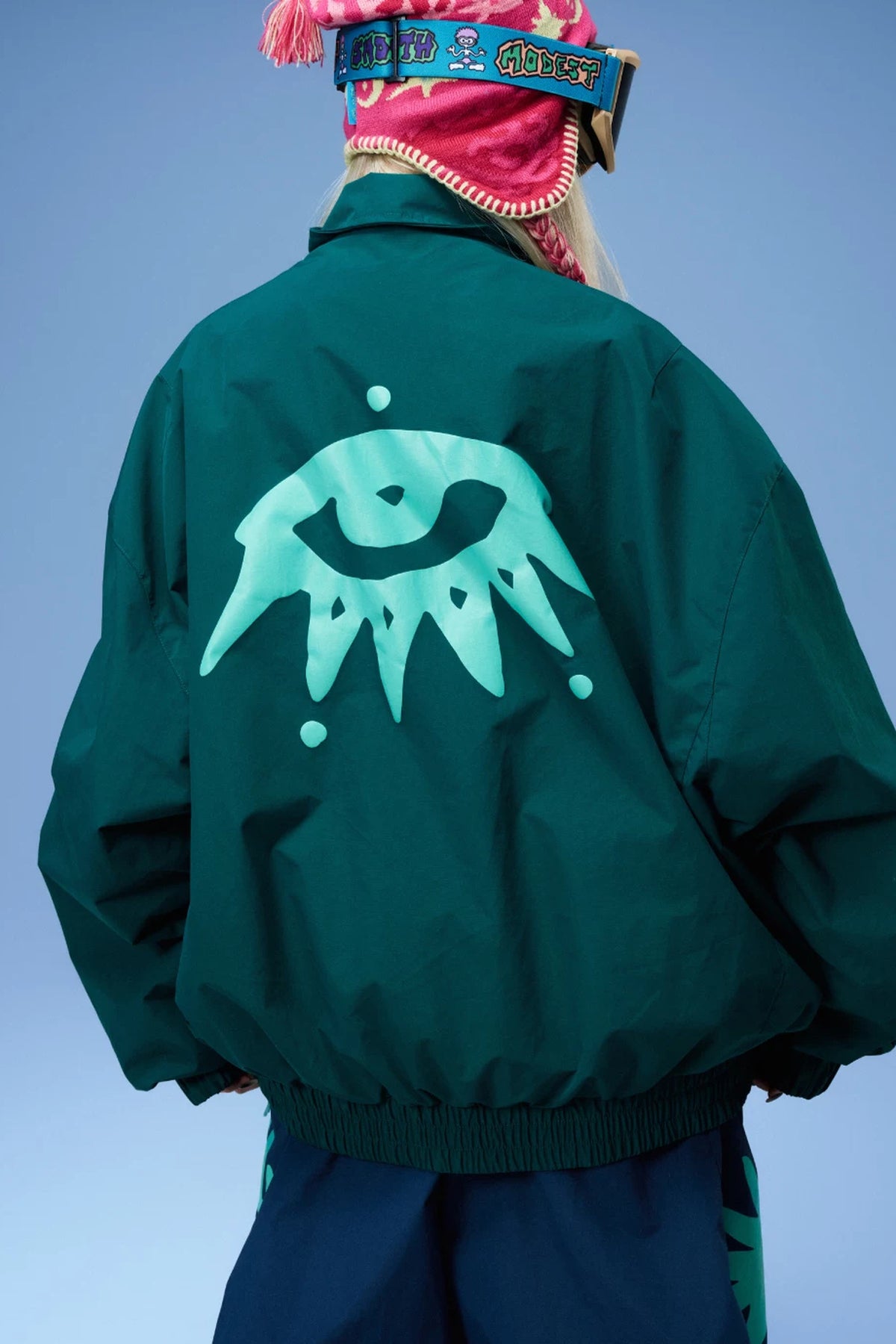OddyEddy Ash Green ski and snowboard jacket back graphic