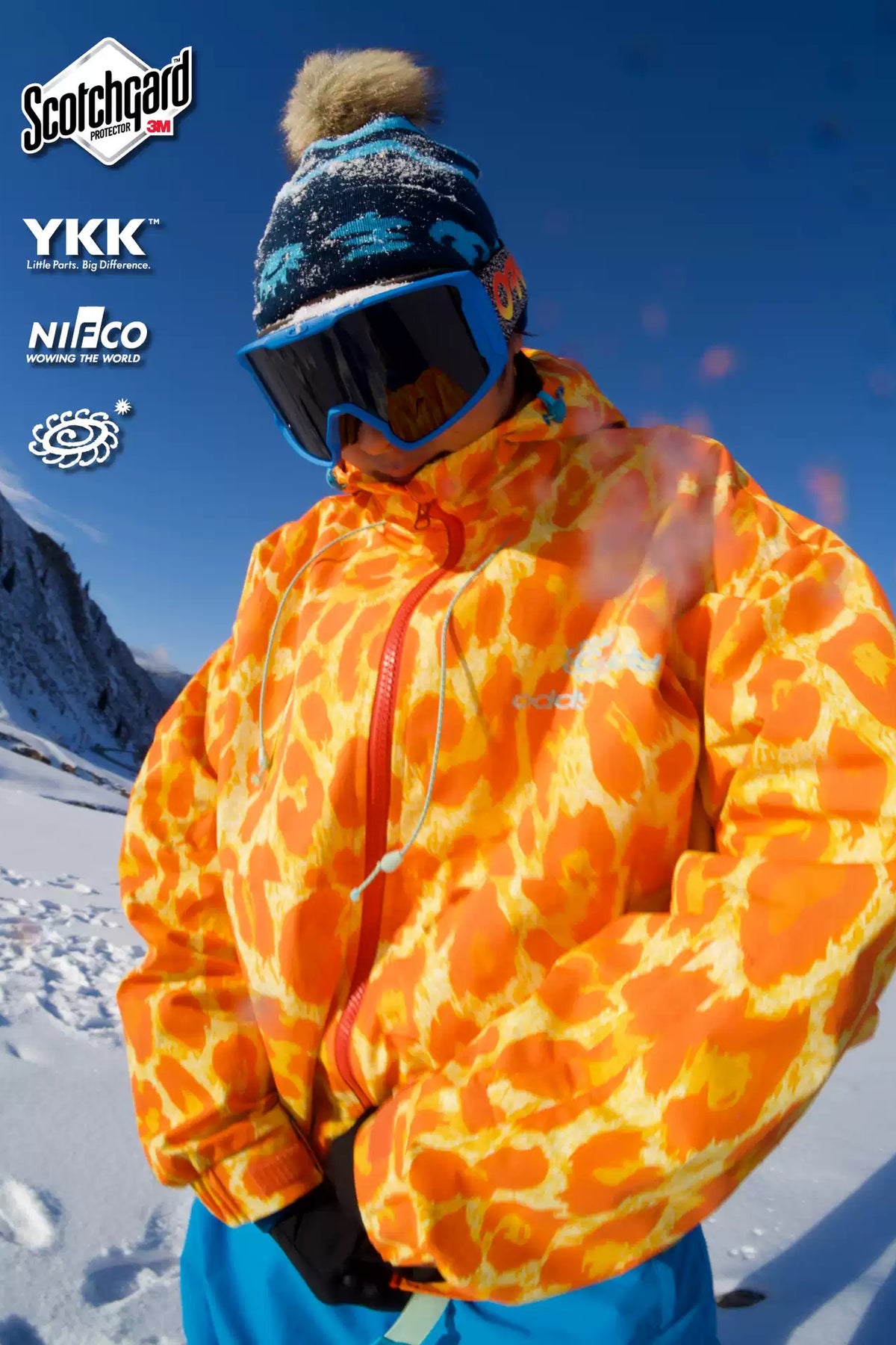 OddyEddy Golden Leopard snowboard jacket on mountain
