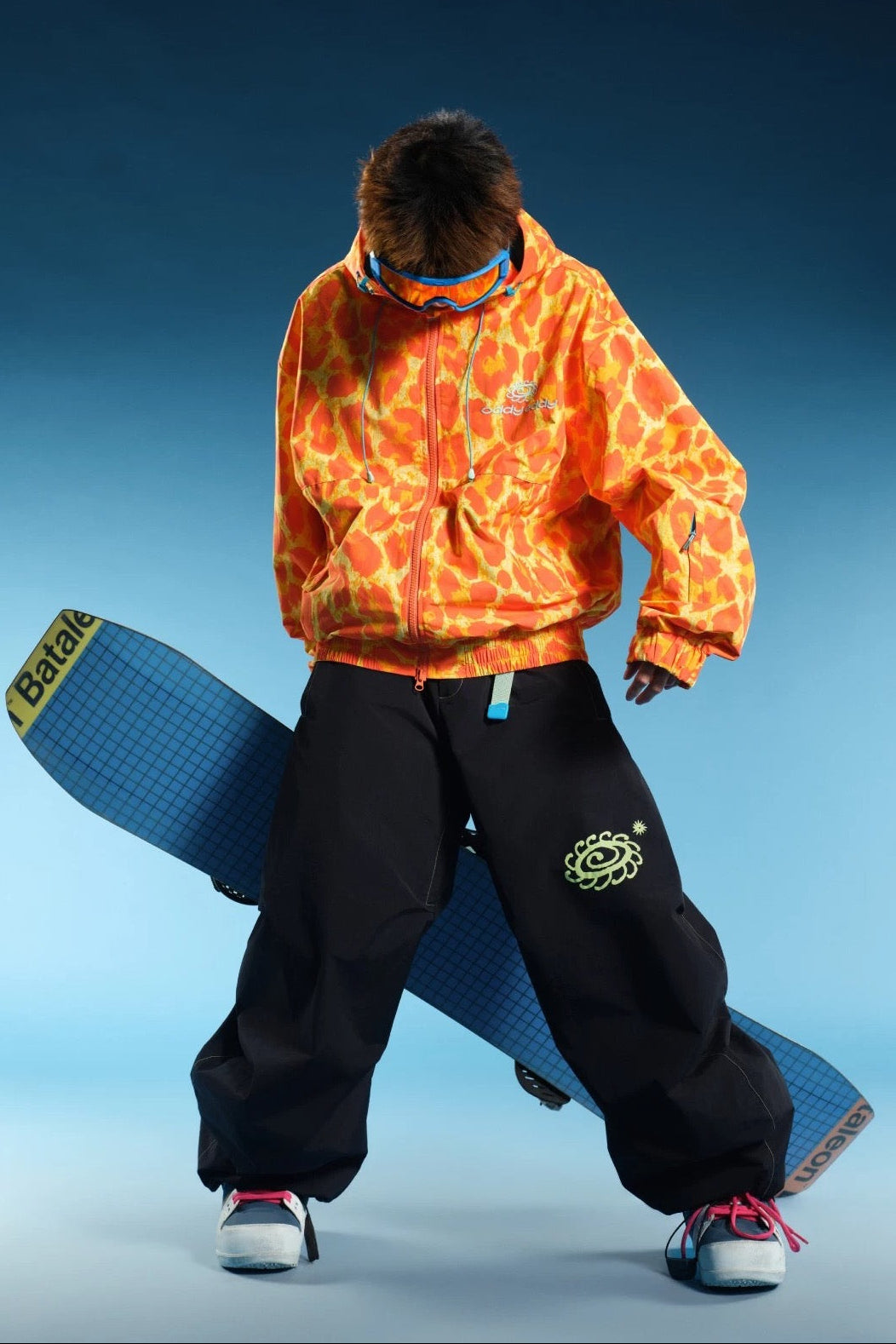 OddyEddy Luna Black snowboard pants styled with a snowboard