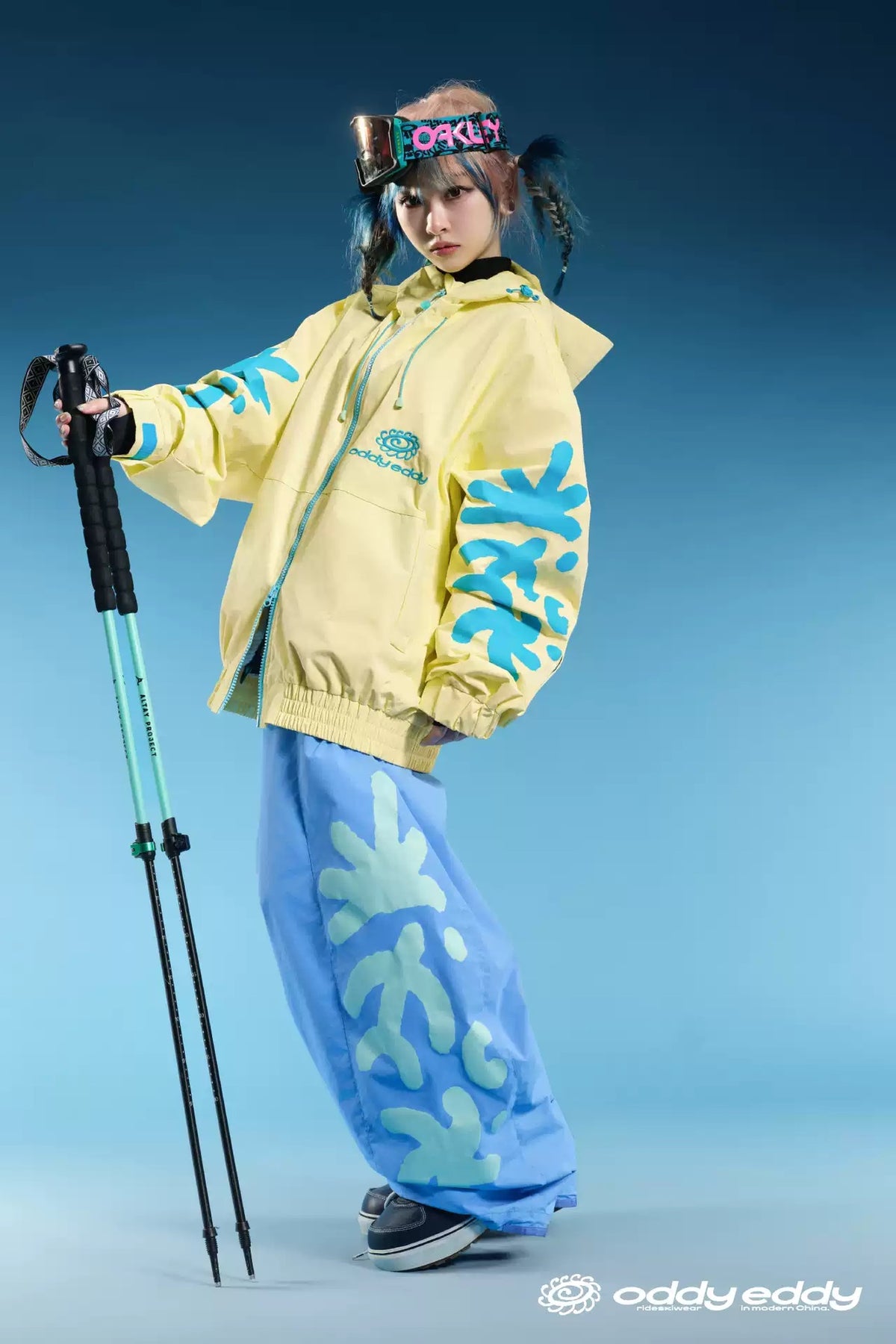 OddyEddy Totem Sky Blue baggy snowboard pants styled on model with full logo