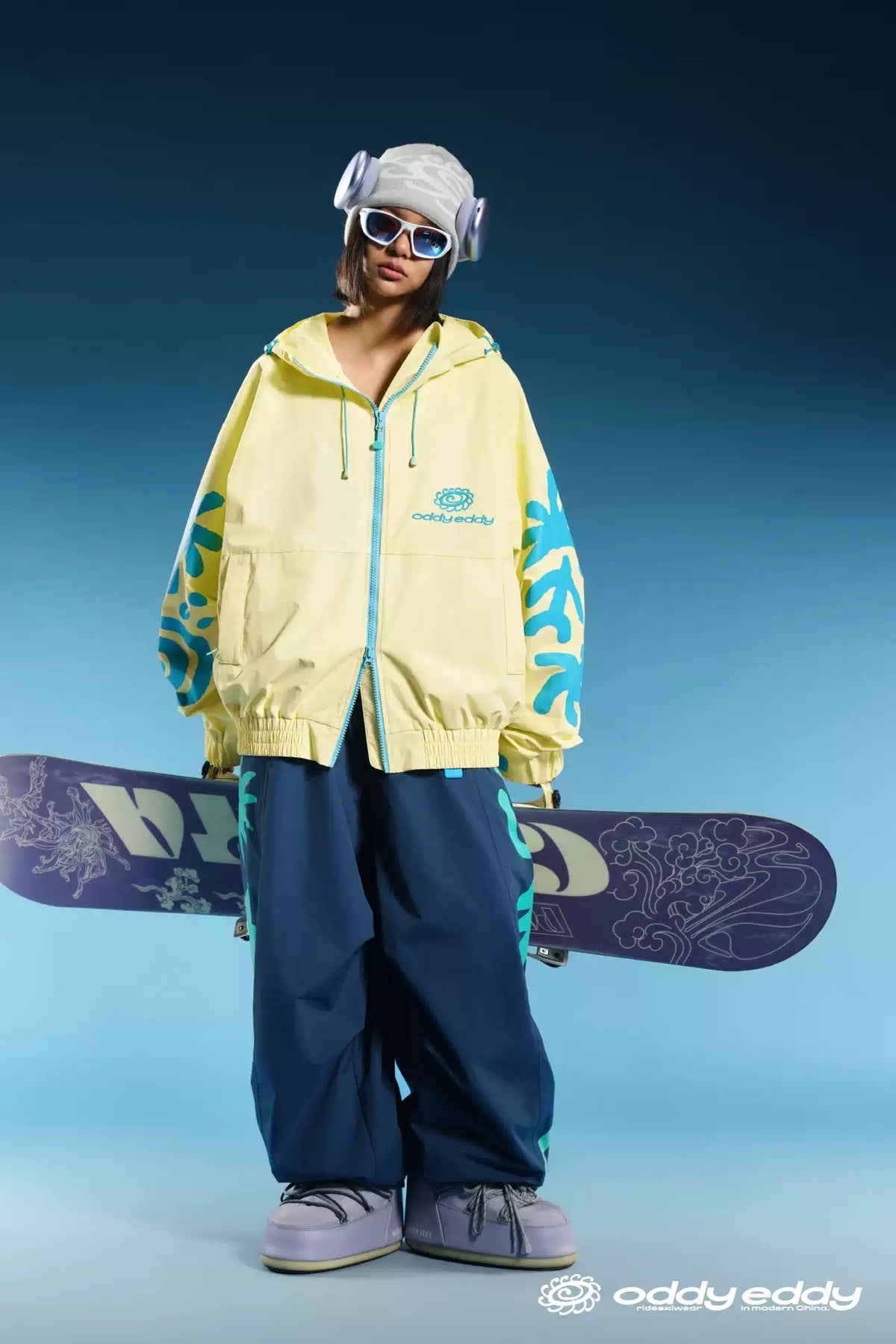 OddyEddy Totem Yellow snowboard ski jacket styled with a snowboard