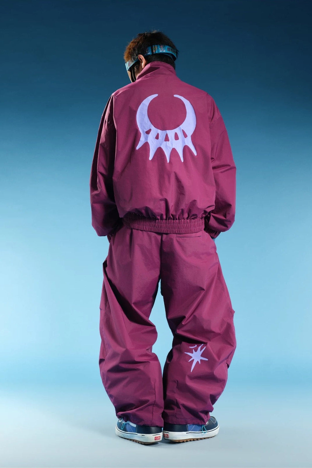 OddyEddy Starlight Purple snowboard pants back view with moon and star graphics