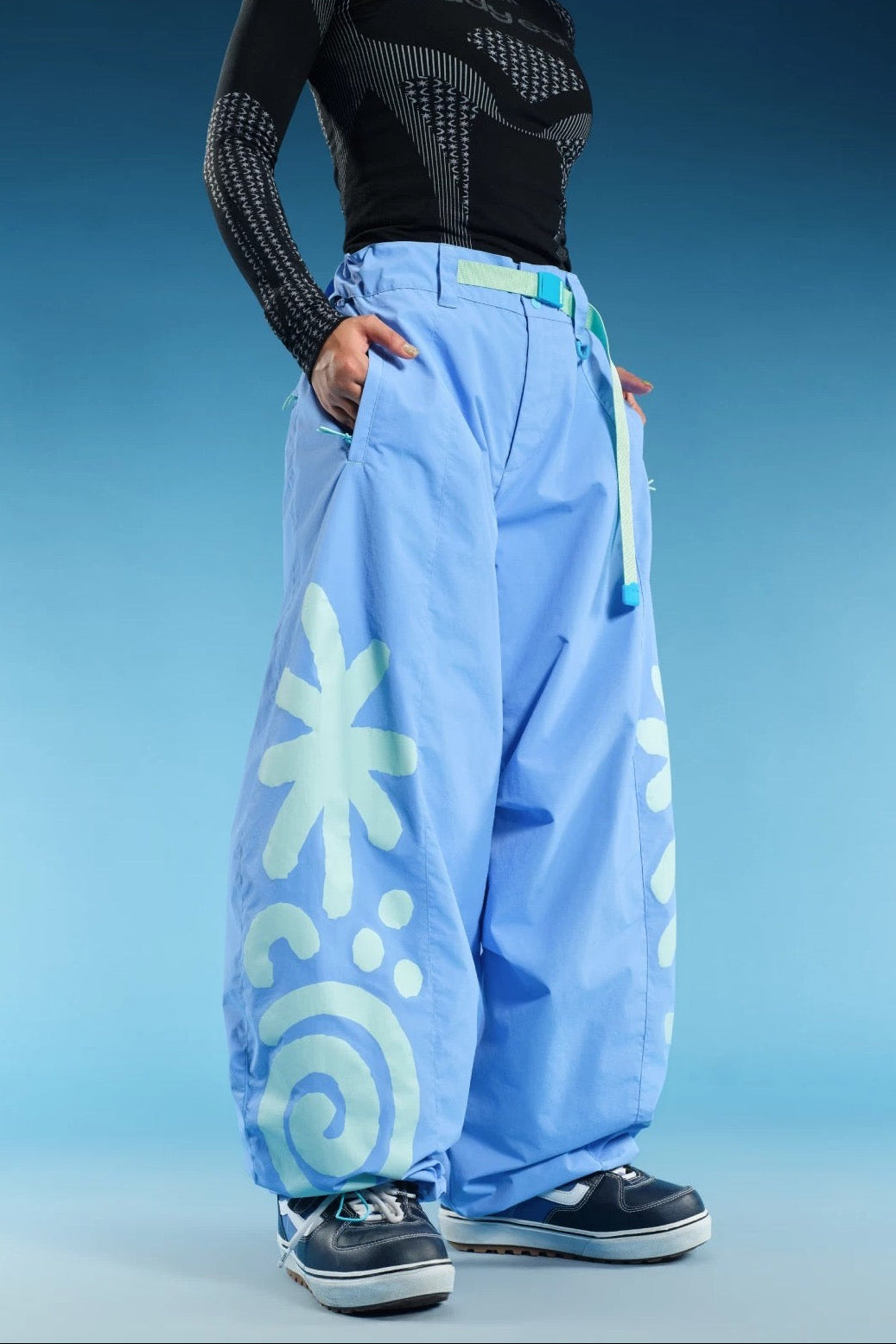 OddyEddy Totem Sky Blue snowboard pants front wide-leg artwork detail