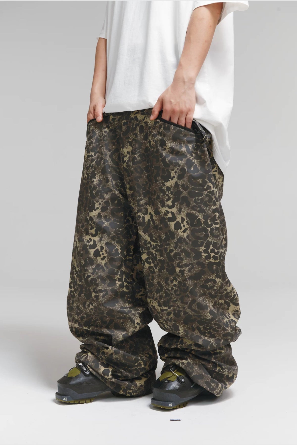 Winter Ticket Freestyle Oversize Leopard Print Snow Pants, angled front view showing wide legs and olive leopard pattern
